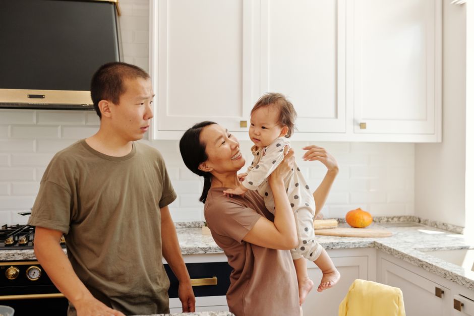 Happy family enjoying their newly renovated kitchen